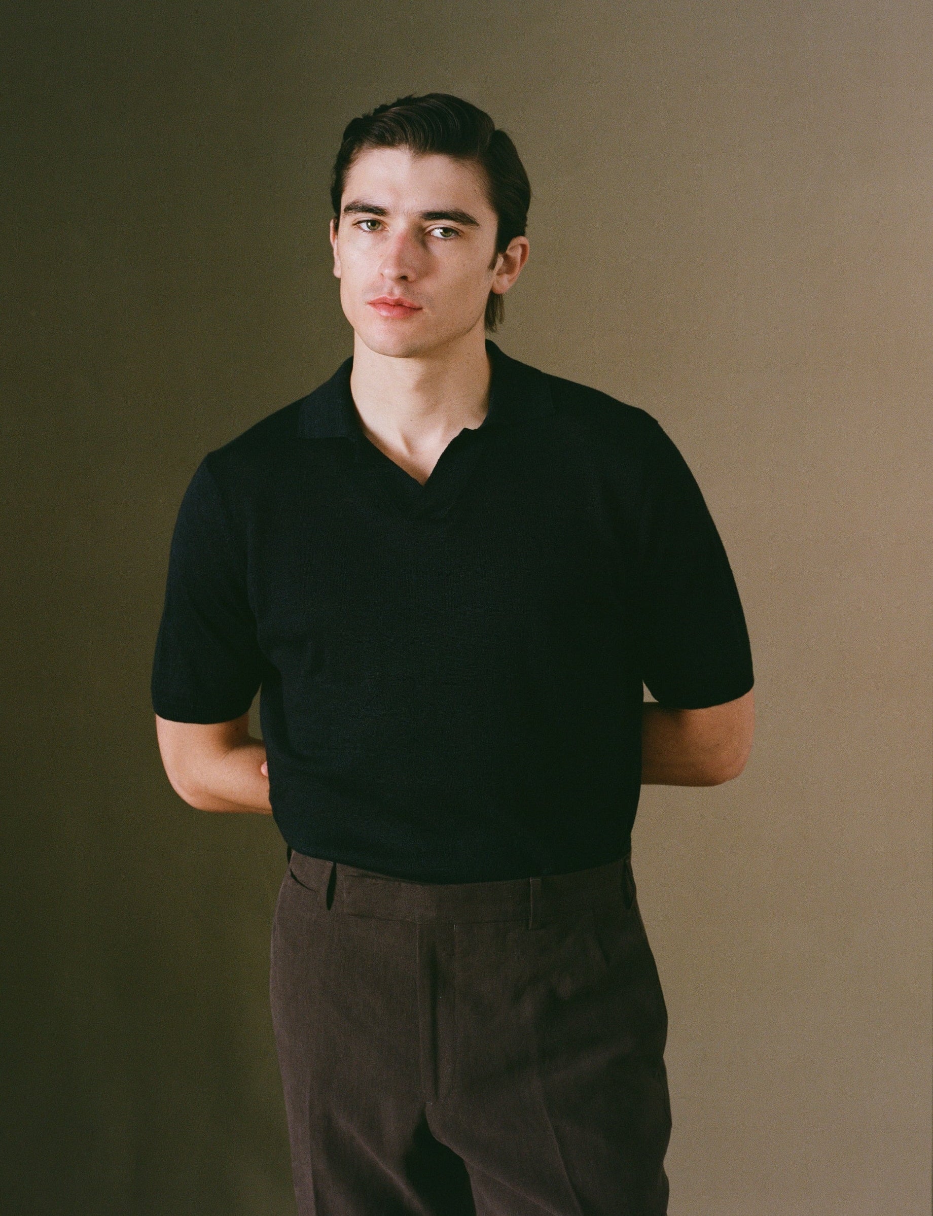 Navy linen short sleeve polo shirt on model