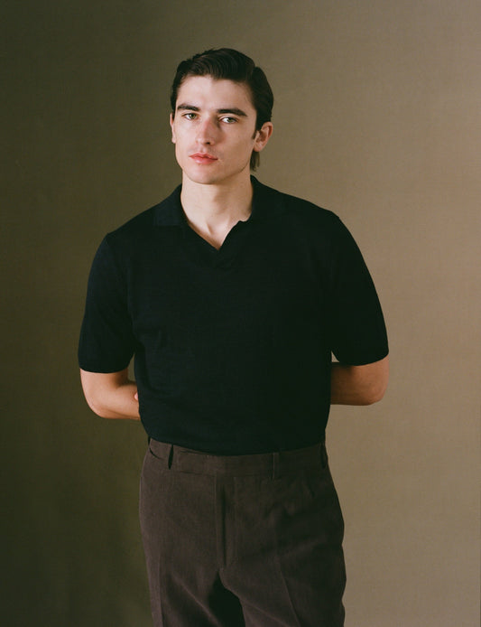 Navy linen short sleeve polo shirt on model