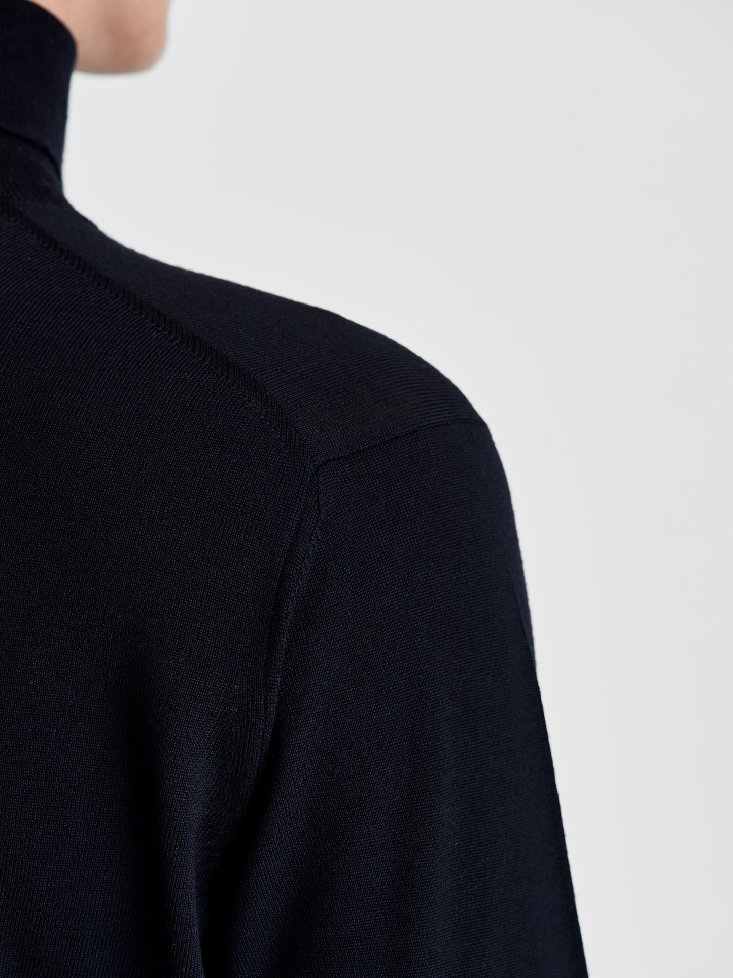 Merino Wool Extrafine Roll neck Sweater Navy Back Detail Model Image