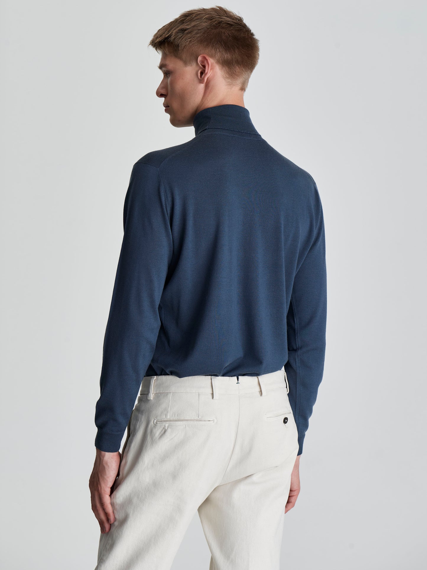 Merino Wool Extrafine Roll Neck Sweater Slate Blue Back Cropped Model Image