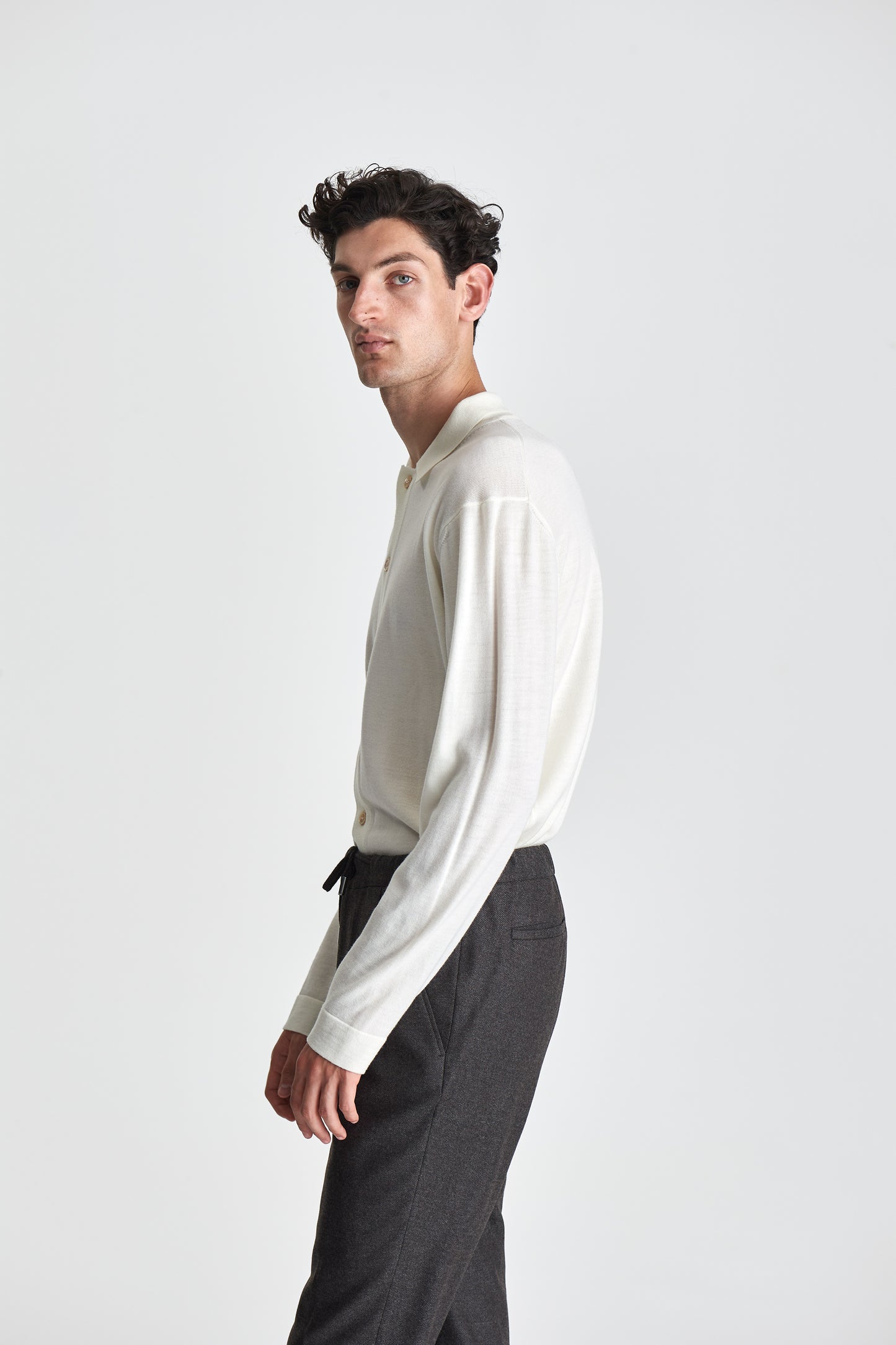 Merino Wool Extrafine Long Sleeve Button Through Polo Shirt Off White Model Side Image