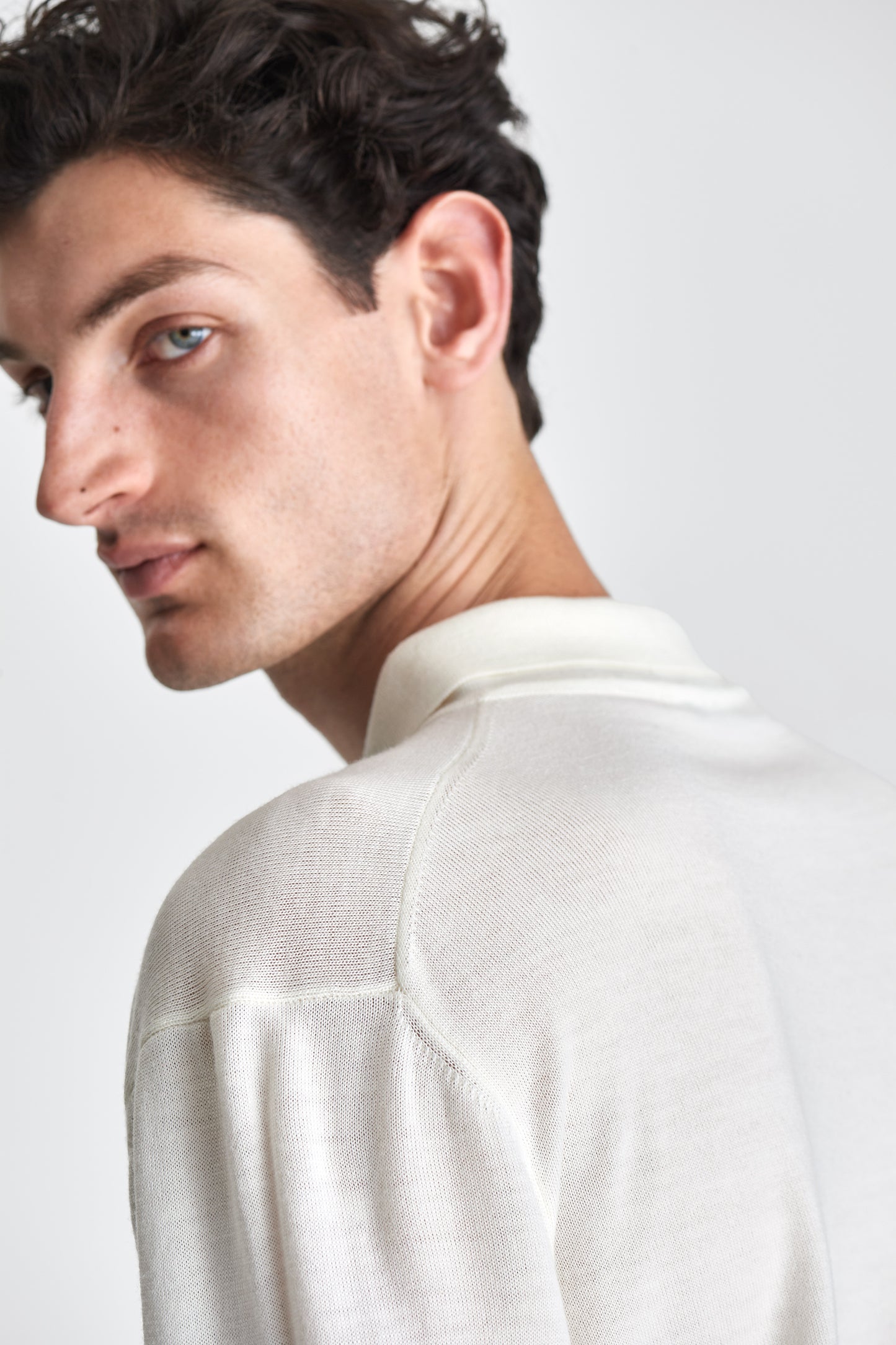 Merino Wool Extrafine Long Sleeve Button Through Polo Shirt Off White Model Shoulder Image