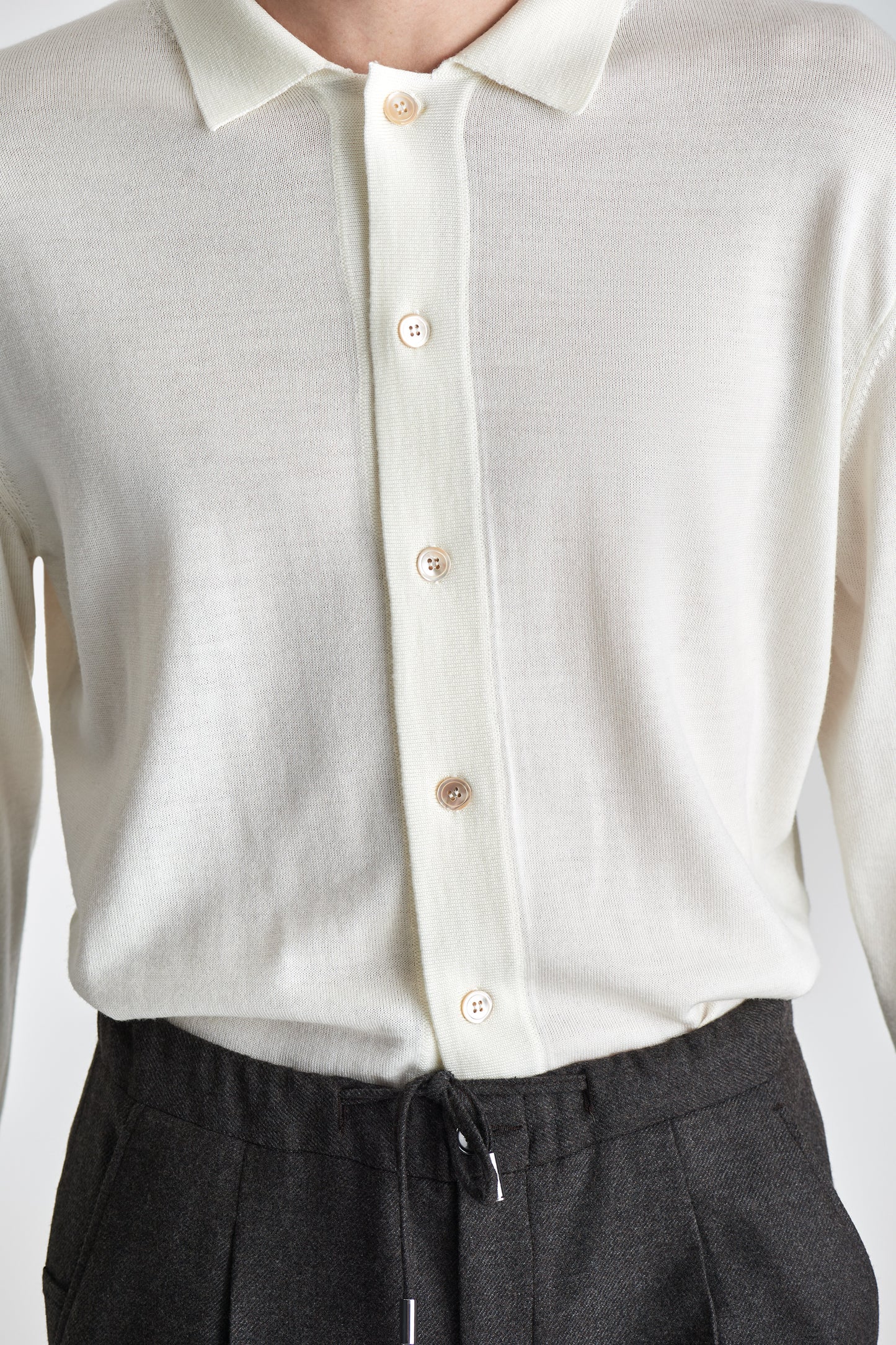 Merino Wool Extrafine Long Sleeve Button Through Polo Shirt Off White Model Buttons Image